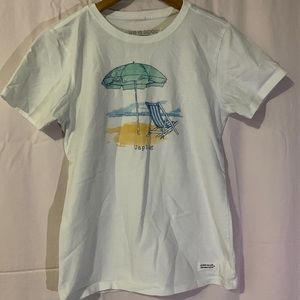 white “life is good” tee.